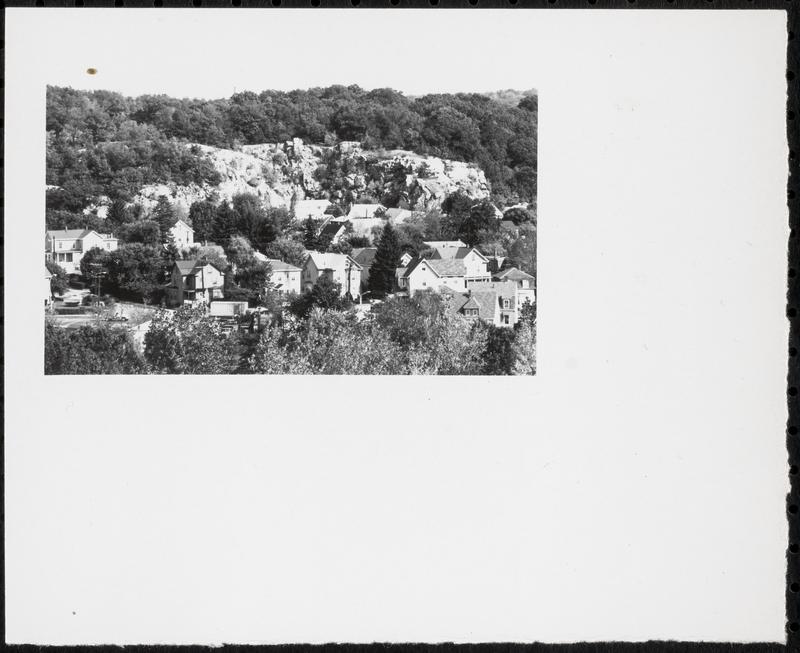 Rock outcroppings above houses
