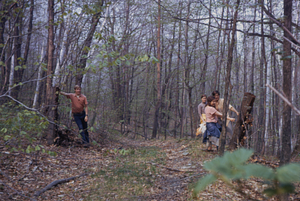 James Cornell '72, Gail Stuart '73, Susan Danver '73, and Jack Kruse '72 examine A.L. Hopkins' upper pasture gate posts across the Upper Loop Trail.