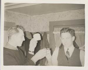 Art E. Rosenburg and Robert Rosenburg with toast and toasting