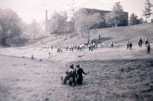 Young men in the muddy bottom of Watershops Pond