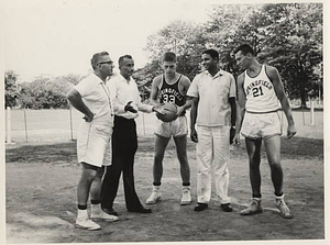 1965 Far East Tour, basketball players standing on dirt court